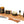 Load image into Gallery viewer, Bearded Man fragrance collection of soy candles natural bar soap beard oil perfume oil sitting on a cedar board with pine cone, vanilla bean, and cinnamon sticks