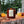 Load image into Gallery viewer, Maple Bourbon Soy Candle in amber tumbler jar with wood wick on tree stump in forest with slice orange and Old Fashioned cocktail pine cone cinnamon sticks by Veil and Dagger fine home goods