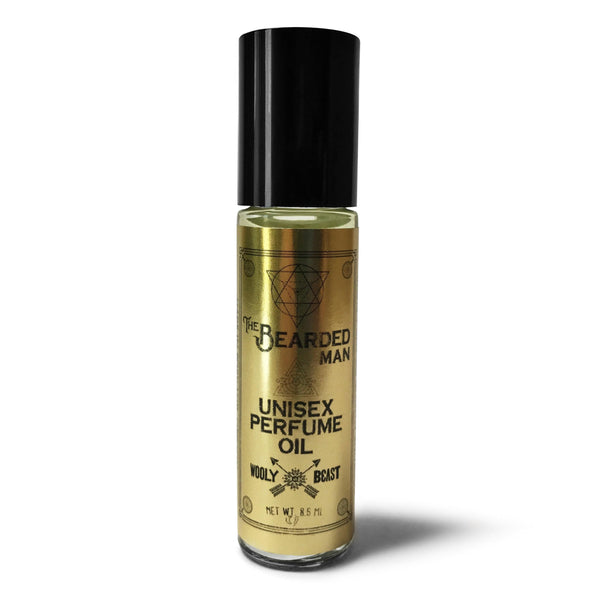 roll on fragrance in glass bottle with black screw top lid on white background, black and gold label has sacred geometry design and reads Bearded Man unisex perfume oil wooly beast crossed arrows logo