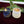 Load image into Gallery viewer, handmade ceramic toothpick matchstick holders in blue dark grey and white cream colors holding red tipped matchsticks on a red velvet fabric with douglas fir branch on tabletop