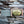 Load image into Gallery viewer, handmade esential oil soap bar coming out of kraft paper box package, lying on driftwood, dark grey soap has wooly beast crossed arrow logo soap stamp, black and gold label has oujia board design and reads supernatural mystical cleansing bar, Dark and Stormy, wooly beast all natural mystical soap