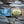 Load image into Gallery viewer, handmade soap bar coming out of kraft paper box package, lying on driftwood, dark grey soap has wooly beast crossed arrow logo soap stamp, black and gold label has oujia board design and reads supernatural mystical cleansing bar, Dark side of the moon, wooly beast all natural mystical soap