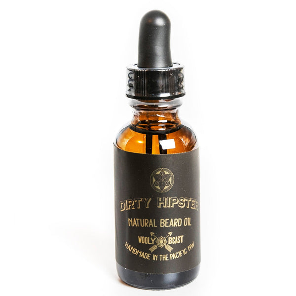Dirty Hipster Natural Beard Oil in 1oz amber bottle with eye dropper on white background black and gold label has sacred geometry design and says Dirty Hipster natural beard oil wooly beast handmade in the pacific northwest