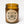 Load image into Gallery viewer, salted caramel ice cream soy candle in amber jar, cotton wick burning, on white background. circle kraft paper label reads salted caramel ice cream portland wooly beast crossed arrows logo, soy wax candle, handmade in portland oregon