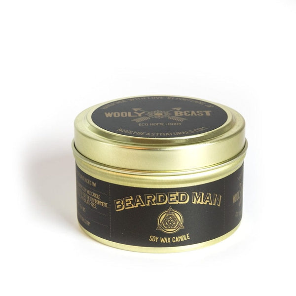 Bearded man scented soy candle in gold travel tin with gold lid on white background black and gold label design has sacred geometry and says bearded man soy wax candle