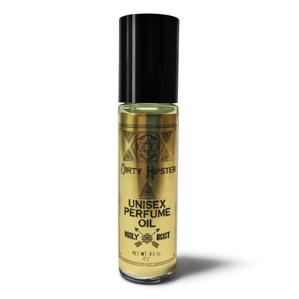 patchouli cedarwood tobacco bergamot DIRTY HIPSTER roll on Fragrance applicator with black cap on white background black and gold label reads Dirty Hipster unisex perfume oil wooly beast logo with sacred geometry design