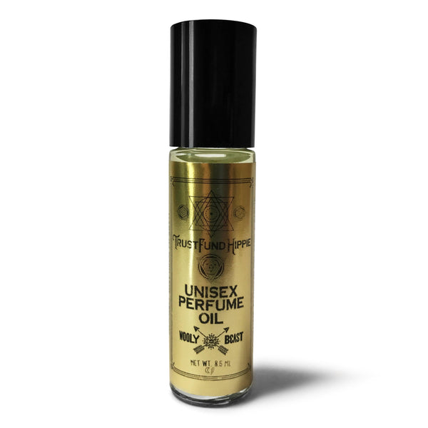 Patchouli and cologne roll on Fragrance applicator Trust Fund Hippie on white background with sacred geometry packaging black and gold label reads unisex perfume oil